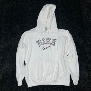 Large white hoodie with Nike logo cow print embroidered on the front